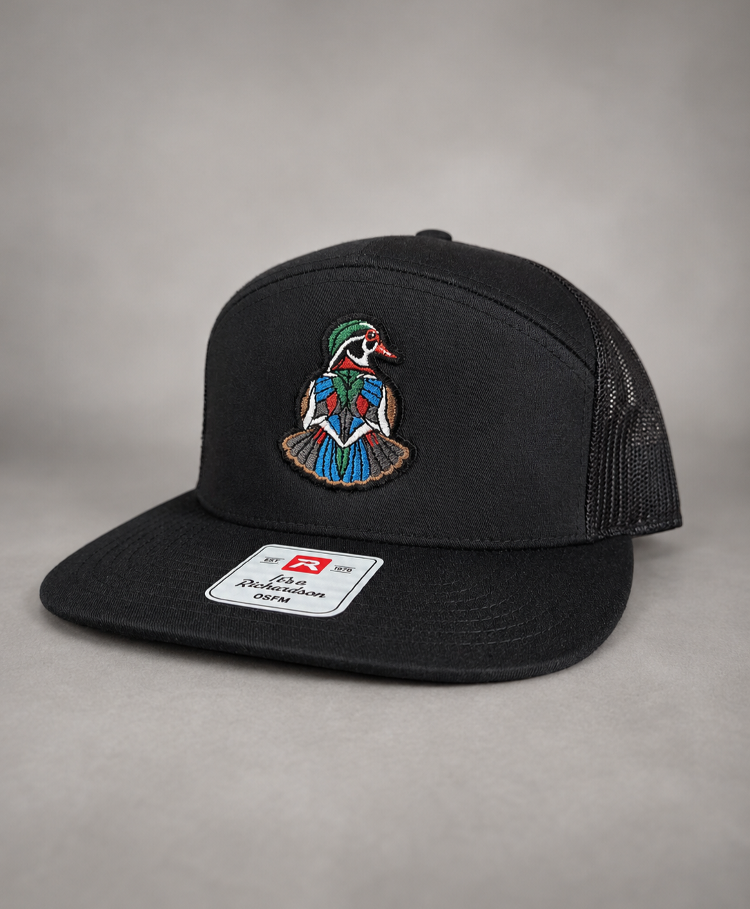 Backpedal all black Richardson trucker hat with embroidered wood duck patch