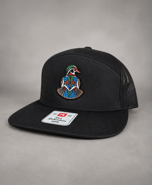 Backpedal all black Richardson trucker hat with embroidered wood duck patch